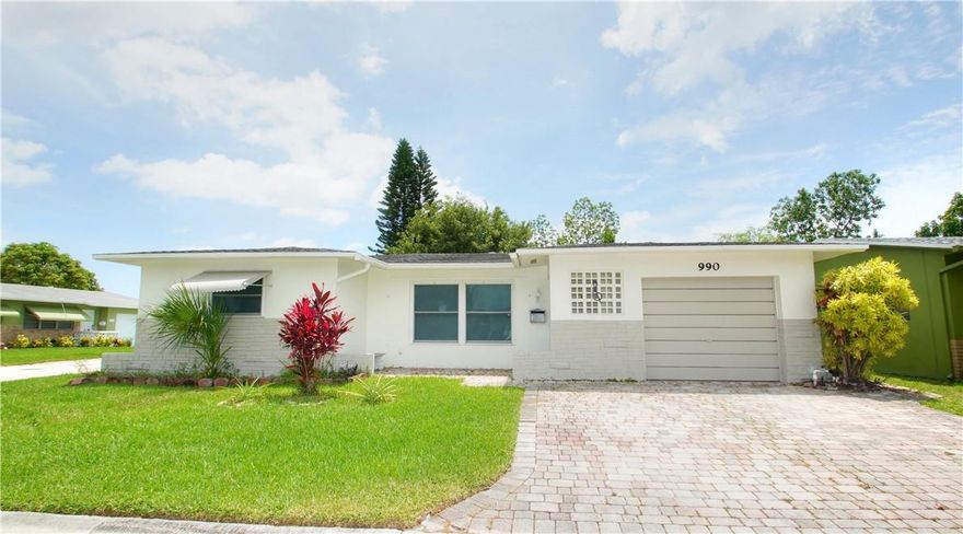 55+ community in Paradise Gardens. Spacious 2/2 with 20x11 family room and 1 car garage. New underground plumbing. Impact windows! Newer white kitchen cabinets and countertops. Remodeled bathrooms. Light and bright throughout. White ceramic tile in living areas- new carpeting in master bedroom. Corner lot across from the clubhouse offers open views to the North. Pretty side and back yard. Ready for immediate move-in. Lawn service included in rent. HOA approval required- 3-4 weeks Good credit and references required!