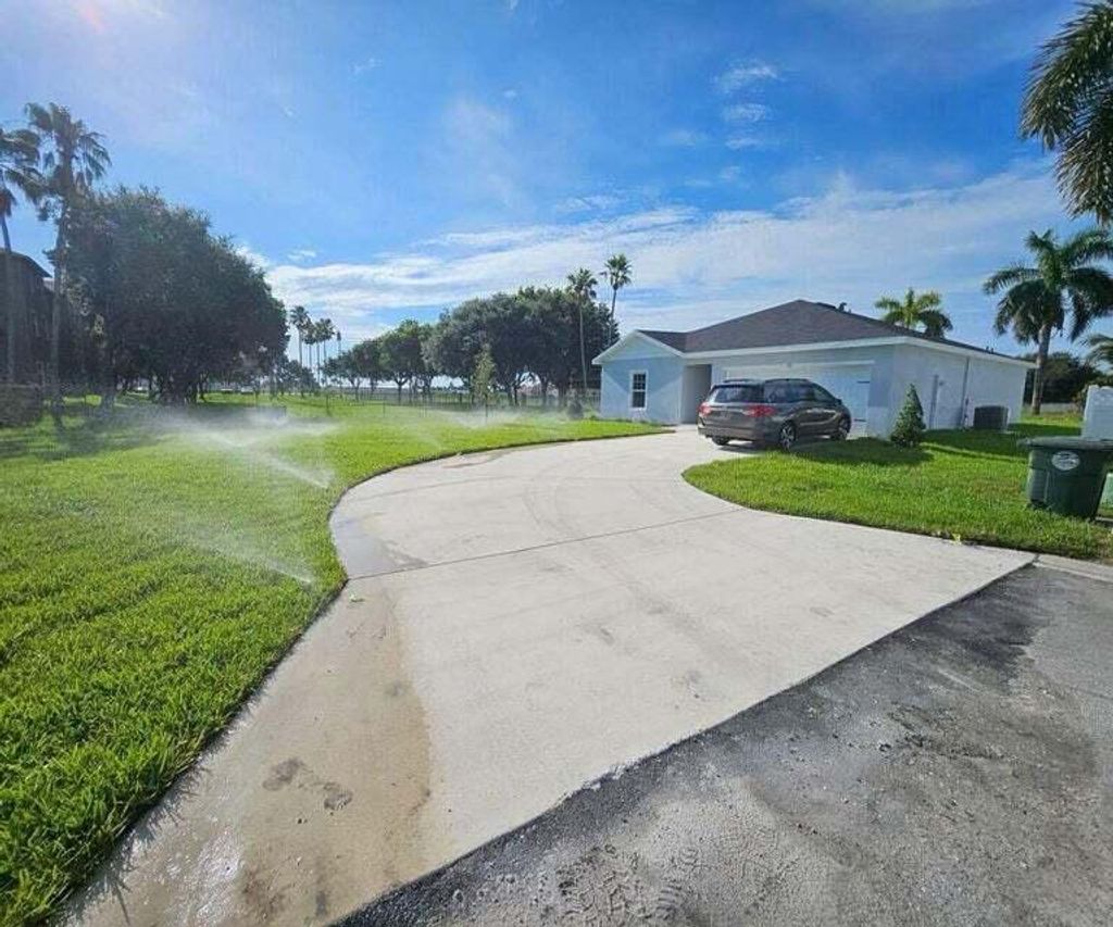 Photo of 136 Dabou Loop, Belle Glade, FL 33430 (MLS # R11020781)
