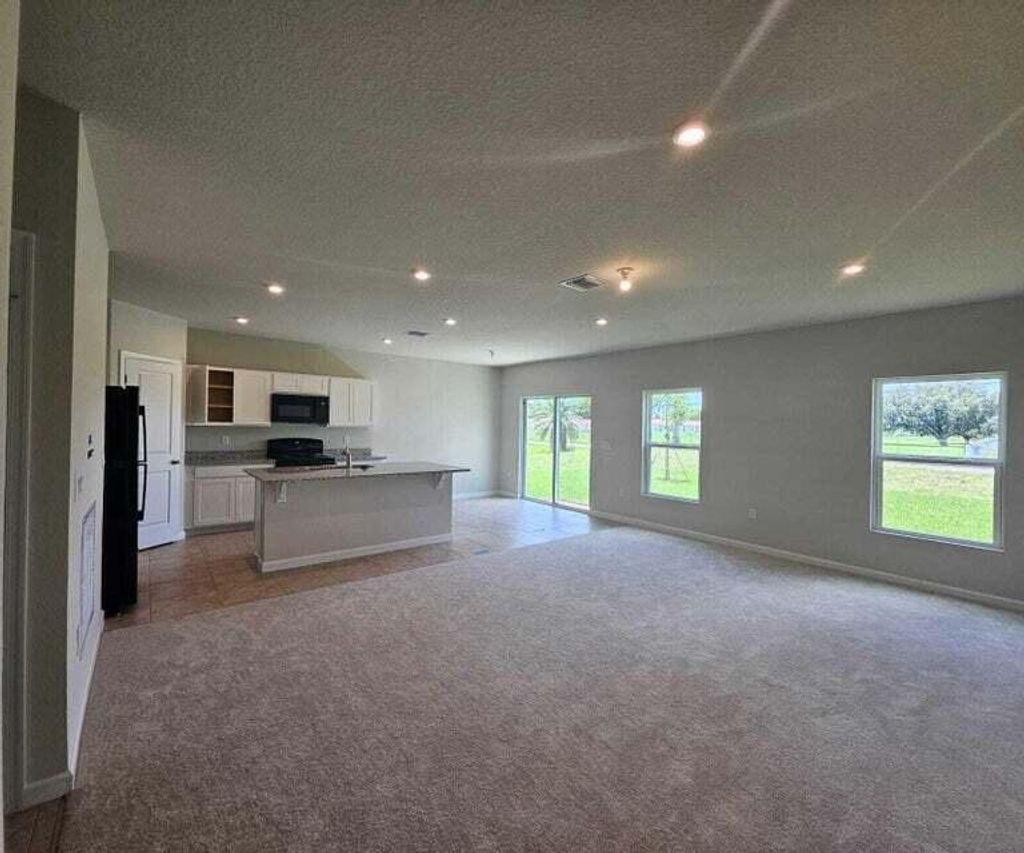 Photo of 136 Dabou Loop, Belle Glade, FL 33430 (MLS # R11020781)