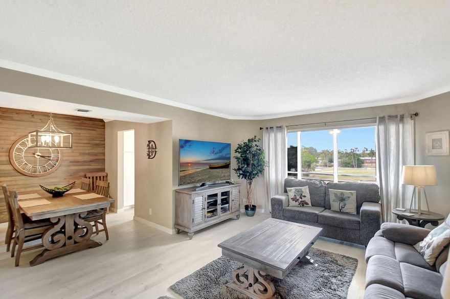 Come live the Florida lifestyle in this beautiful golf course view condo, located in the desirable 55+ community of Poinciana Country Club. This 2-bedroom, 2-bathroom condo offers stunning laminate flooring throughout the main living areas and bedrooms. Enjoy peaceful golf course and sunset views from your enclosed balcony — the perfect spot for relaxing or entertaining with a true indoor/outdoor feel. The spacious primary suite features his-and-her closets, including a walk-in, and a private en-suite bath. The split bedroom floor plan provides added privacy, with the guest bedroom and bathroom located on the opposite side of the unit. A separate dining room enhances the space for entertaining, and the washer/dryer is conveniently located inside the unit. Take advantage of all that Poinciana has to offer - dine or sing karaoke at Mel's Bistro in the Clubhouse, enjoy a round of golf on the 18-hole course, or relax at one of the two heated pools. Additional amenities include a fitness center, ballroom, billiards, tennis, and more.

Conveniently located near shopping, restaurants, and the Turnpike. Condo fees include cable, water, internet, building maintenance, and more. Don't miss your chance to experience resort-style living in this wonderful community.