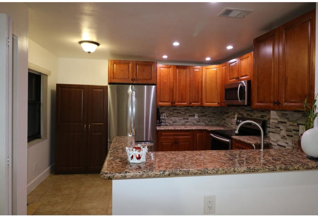 Photo of 11333 Royal Palm Blvd #E-1, Coral Springs, FL 33065 (MLS # B26000999)