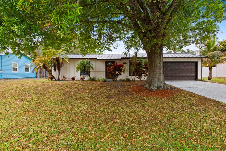 Beautifully updated 2BR/2BA home in the heart of Port St. Lucie featuring a NEW ROOF, NEW water heater, and newer A/C. This move-in-ready home offers a bright open layout with new bedroom flooring and fresh neutral paint throughout. The kitchen includes brand-new stainless steel appliances and ample counter space. Enjoy the spacious screened patio overlooking a large, fenced backyard—perfect for entertaining or relaxing. Additional features include a freshly epoxied garage floor and mature landscaping for great curb appeal. Conveniently located near shopping, dining, parks, and beaches. Don't miss this opportunity!