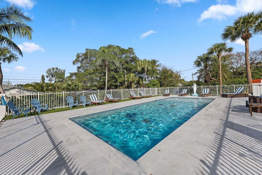CHARMING HOME ON A DOUBLE LOT, with resort style pool.  This 1930 Spanish Style Home  still has the original fireplace.  Completely updated kitchen and bathrooms with Shaker Cabinets, Granite Countertops and Stainless Appliances.  This Home has 2023 new roof.Calling all buyers and investors!!  Come see for yourself the endless opportunities.The is 2 bed/ 1 bath upper level and 1 bed/ 1 bath with den on lower level.