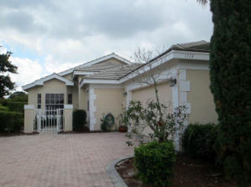 AMAZING CONDITION IN ONE OF THE MOST SOUGHT AFTER COMMUNITIES IN WELLINGTON.  THREE BEDROOMS, 2 BATHS, 2 CAR GARAGE HOME IN LAKEFIELD NORTH. GATED COMMUNITY WITH VERY LOW HOA FEES TO PAY. THIS HOME FEATURES A LARGE LIVING AREA, NICE SIZE DINING ROOM WITH BAY WINDOW OVERLOOKING THE ATTRACTIVE FRONT YARD.  THE KITCHEN IS FUNCTIONAL WITH LOTS OF CABINETRY AND BREAKFAST NOOK AREA.  NEW ENGINEERED WOOD IN ROOMS AND CERAMIC TILE IN SOCIAL AREAS. THE MASTER BEDROOM OFFERS HIS AND HERS CLOSETS AND NICE SIZE MASTER BATHROOM. THE BACK HAS A LARGE SIZE SCREENED IN PATIO FOR RELAXING AFTERNOON/EVENINGS. THIS HOME IS CENTRALLY LOCATED CLOSE TO EQUESTRIAN GROUNDS AND ''A'' RATED SCHOOLS, VERY LIGHT AND BRIGHT. DON'T MISS THIS GREAT GEM, IT WILL GO FAST!!!!!