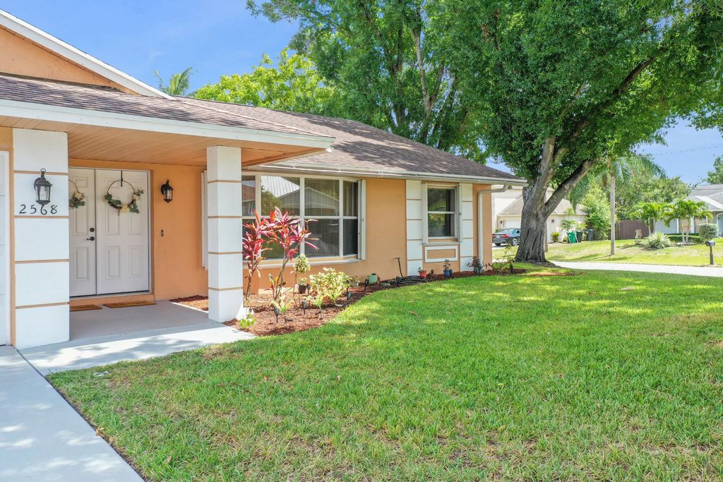 Photo of 2568 SW Grotto Circle, Port Saint Lucie, FL 34953 (MLS # R10995892)