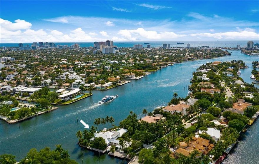 Rare & prominent point captures the most spectacular wide New River views from almost every room! Offering 348ft +/- deepwater dockage & sophisticated resort-style island living. Privacy abounds with established tropical landscaping surrounding entire custom residence, pool area & guest bungalow. Stunning simplicity prevails - crisp white exteriors with metal roof to casually inviting St. Barth's inspired interiors.European white oak floors throughout compliment the expansive open great room, adjoining Chef's kitchen & breakfast area. Secondary bedroom suites occupy a private wing, entire second level master retreat has spa-style bath & large private balcony.Valuable 164ft +/- side dockage also offers unique cut-in slip for smaller boat. Over 28,487sf land offers expansion opportunity - House taken down to studs & structure brought to code 2013-2015 included adding structural steel & clips- Aluminum impact glass windows - Fleetwood & CRL - New HVAC- New metal roof on main residence & cottage- New plumbing above slab- New high voltage lighting - CAT5 wiring- 166 ft on the side canal perfect for larger yacht plus tender in the cut-in dock which accommodates upto 36ft- New custom kitchen, Sub-Zero, Miele & Wolf appliances.- New drywall & framing- 10" White Oak European flooring- Comprehensive security system - 2021 dock & Neptune boatlift (upto 10,000 lbs) - 3 x 50 amp pedestals plus provision for 100 amp supply- Newly refinished pool & spa- Smart irrigation system- Mature landscaping includes specimen palms- Coral driveway, pool deck & winding pathways throughout- Renovation included the guest cottage- Garages & residence can be expanded due to large property size.