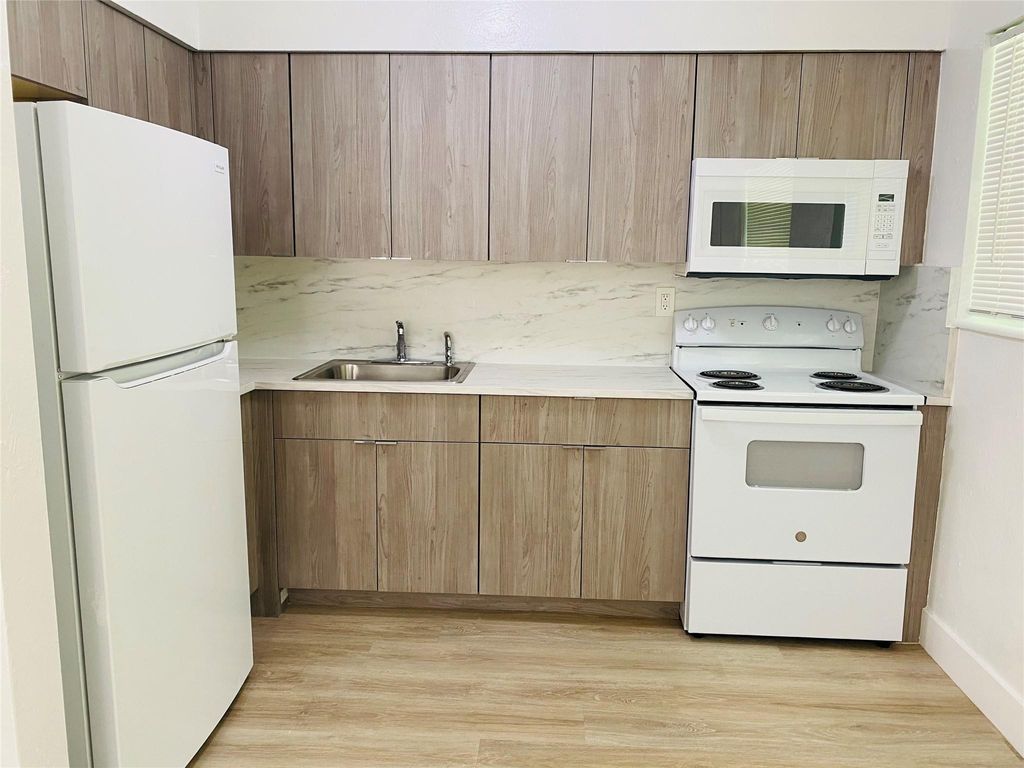 Photo of 1548 NW 52nd Avenue #1, Lauderhill, FL 33313 (MLS # F10519975)