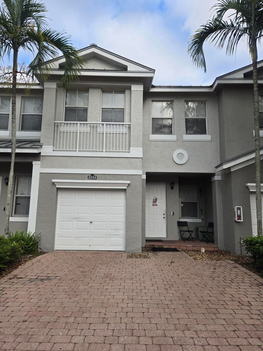 Calling investors for this Two story townhome in desirable gated development Shoma Homes! Generate income from day one as this property is rented to long term tenants (  lease ending on January 31 2027 at $3611/mo) This unit features brand new kitchen granite countertops ( installed in December 2024), brand new water heater & new washer & dryer ( both installed in January 2025), newer laminate floors throughout 2nd floor & tiled downstairs, fairly new stainless steel kitchen appliances. Ac is few years old, brand new metal roofs ( installed in 2024), and the development is scheduled to be painted this year. The townhome features all 4 bedrooms upstairs, separate living & dining rooms downstairs, 2 car driveway + 1 car garage! ''A'' rated school district, walk to Publix plaza, close  to FL Turnpike, 2 miles away from Wellington Hospital & Wellington Mall, just short 12 min drive to equestrian fields. Perfect location surrounded by parks, number of shopping plazas, all kinds of restaurants and entertainment! Condo fees cover building insurance, roof maintenance, trash removal, landscaping, swimming pool servicing, reserve funds, gates,  professional property management on premises & more!  Don't miss this great investment opportunity!