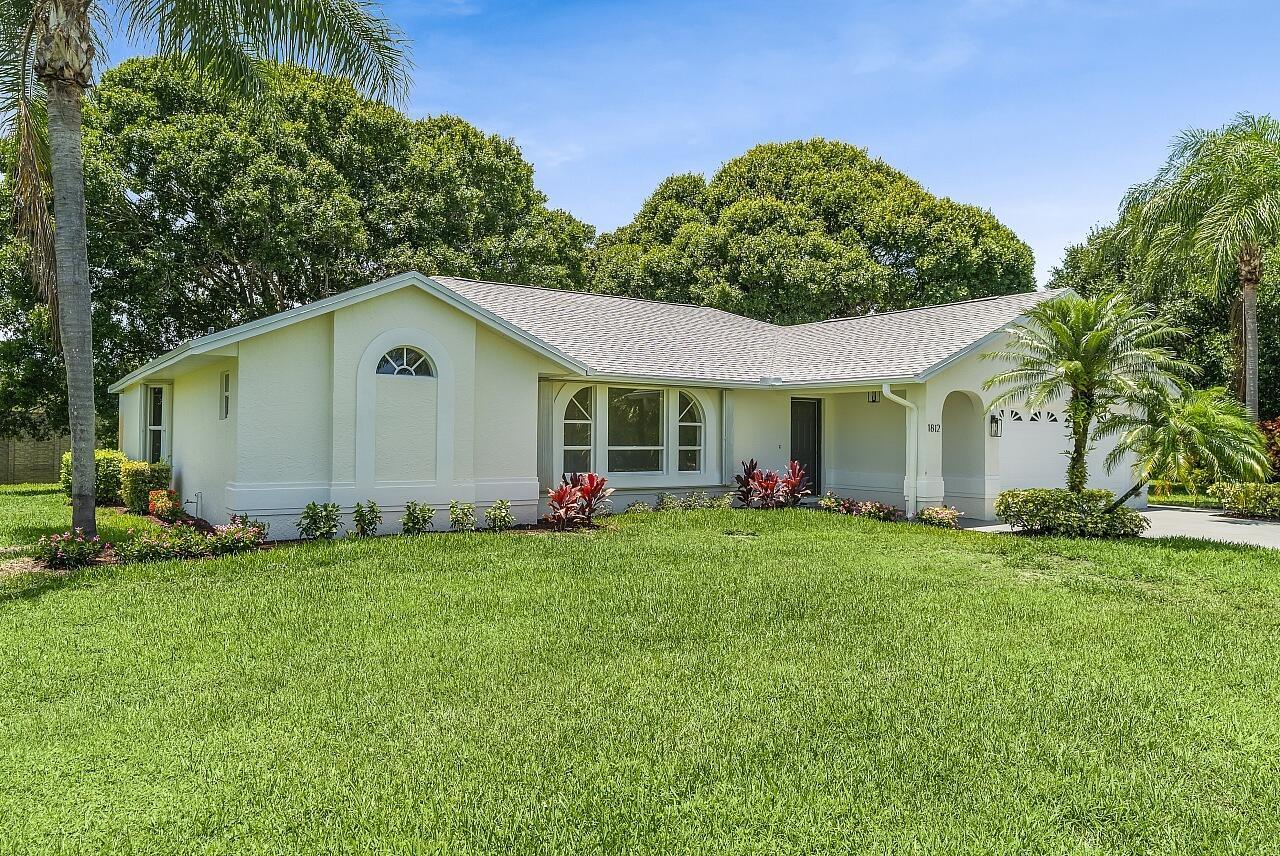 Don't miss this rare opportunity--priced lower than any other home in Pinecrest Lakes! Some photos are virtually staged. This 3-bed, 2-bath, 2-car garage CBS home sits on over half an acre in one of Jensen Beach's most sought-after neighborhoods. New 2025 roof, 2021 A/C, freshly painted inside & out, & brand-new carpet make it truly move-in ready. A light, bright split-bedroom layout with spacious living areas perfect for both relaxing and entertaining. The large backyard has ample space for a future pool, patio, or garden--let your imagination run wild! Neighborhood perks include tennis courts, a playground, and serene surroundings. All minutes from shopping, dining, top-rated schools, downtown Jensen Beach, and just a short drive to sun-soaked beaches and water adventures