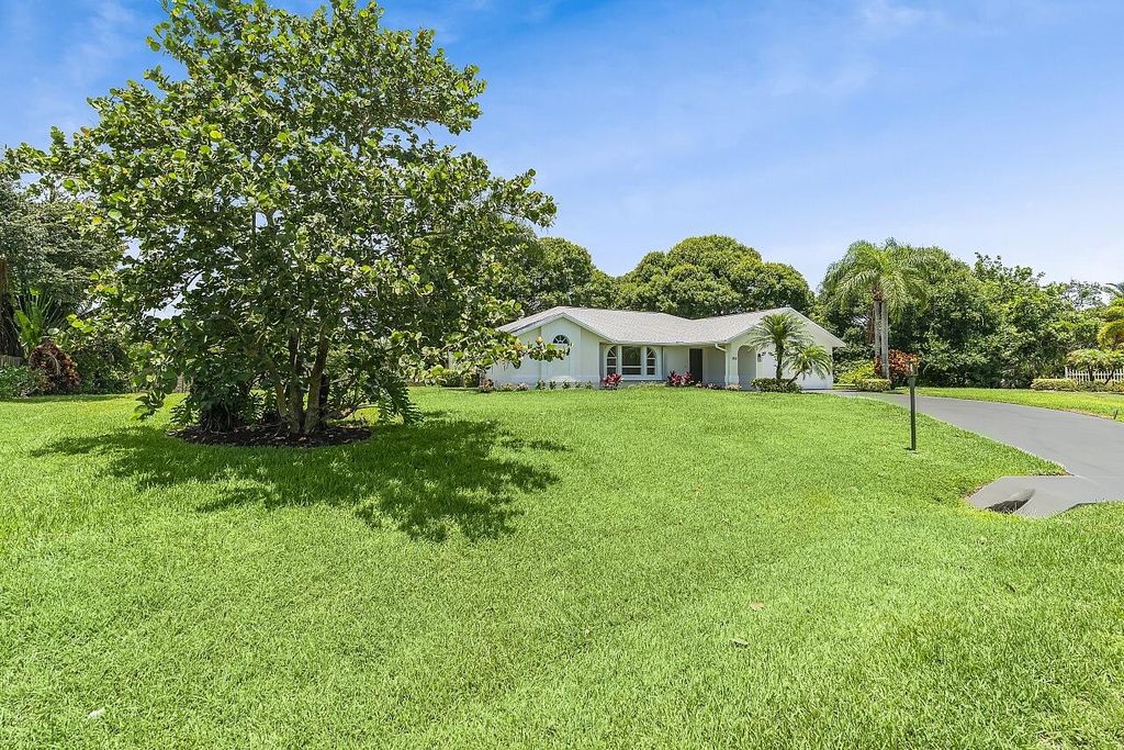 Photo of 1812 NE Crabtree Lane, Jensen Beach, FL 34957 (MLS # R11099370)