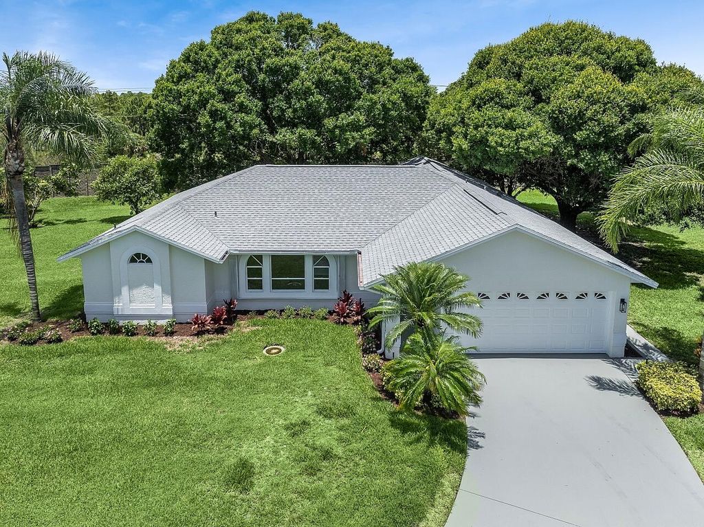 Photo of 1812 NE Crabtree Lane, Jensen Beach, FL 34957 (MLS # R11099370)