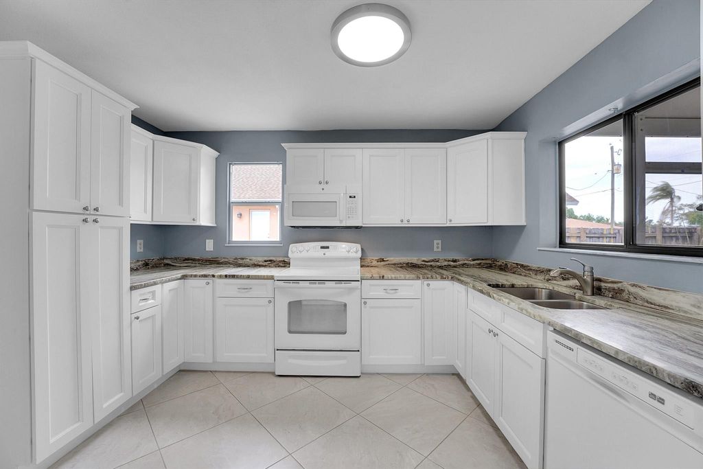 Photo of 2149 SE Stargrass Street, Port Saint Lucie, FL 34984 (MLS # R10972345)