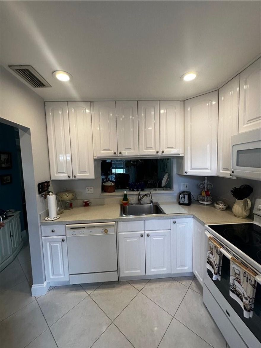 Beautifully updated  2/2 in a 55+ community. The condo was recently renovated which includes Kitchen, Bathrooms, doors, lighting. popcorn ceilings have been removed. A/c was changed in 2020. enclosed/screened patio. located on the first floor. Quiet community with a heated pool, a fitness center and a social room. Building has community laundry in each floor. Pets allowed. Assigned parking space and plenty of guest spots. Central location close to Hospital, shopping and restaurants. Must see to appreciate!