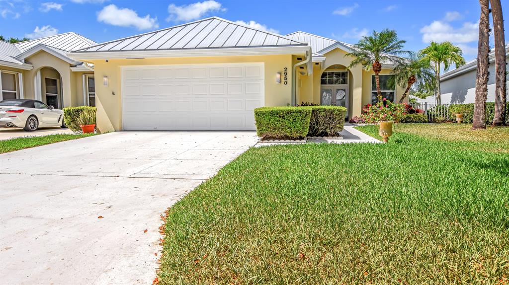 Lovely 3 bedroom renovated home located in much sought after neighborhood, The Meadows. It has a beautiful panoramic view of the lake with a new large insulated screened -in Lanai with fans. The list of upgrades is quite extensive. Starting with newer Metal Roof-2015, A/C-2018, impact windows with new blinds, Gorgeous glass impact front door, luxury vinyl tile throughout, updated bathrooms with new toilets and faucets, new hot water heater and water softener system, led lights and fans throughout, popcorn ceiling removed with new knockdown coat with fresh paint, closet systems installed, added insulation in attic, painted garage floor, lots of upgraded electrical switches and outlets and last, upgraded plumbing to code to allow for insurance coverage. Must see to appreciate
