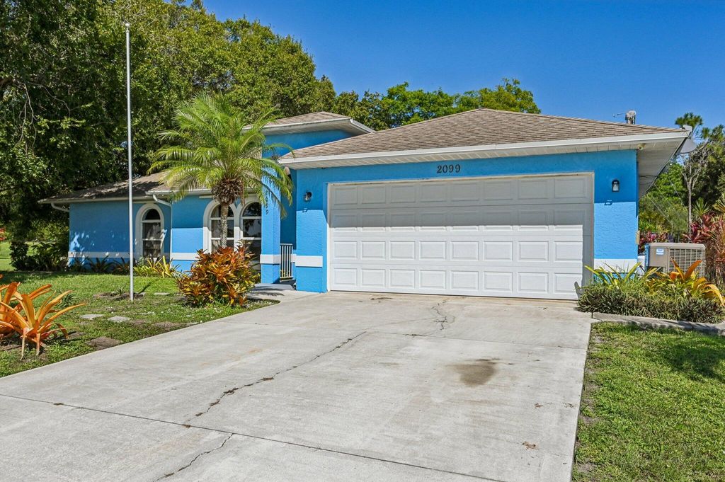 Photo of 2099 SW Janette Avenue, Port Saint Lucie, FL 34953 (MLS # R11132968)