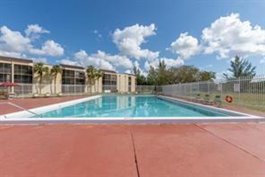 SPACIOUS FIRST FLOOR CORNER UNIT, OPEN KITCHEN, WALK-IN CLOSETS, 1 AND 1/2 BATHROOMS, STACKABLE WASHER AND DRYER IN THE UNIT, LARGE SCREENED PORCH. COMPLEX HAS A NICE POOL AND AMPLE PARKING
