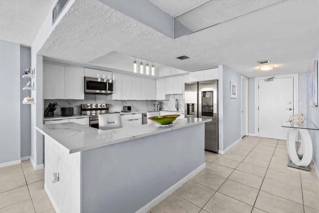 Photo of 10410 S Ocean Drive #908, Jensen Beach, FL 34957 (MLS # F10533374)