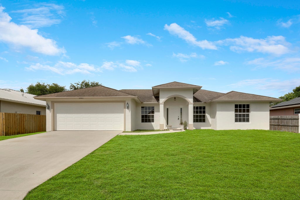 Photo of 1942 SW Hampshire Lane, Port Saint Lucie, FL 34953 (MLS # R11017439)
