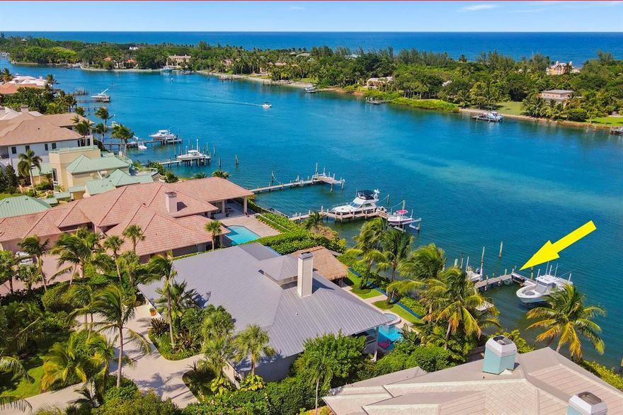 Enjoy the Bahama-blue water from every angle of this Key West-style home in prestigious Indian Hill! Its elevated property provides panoramic views of Tequesta's breathtaking Intracoastal Waterway from the moment you enter the home. The spacious floor plan includes 4 bedrooms, an office, 3 bathrooms & a powder room, 2-car garage, balconies overlooking the pool, and private dock with boat lifts. Relax under the custom built tiki hut, complete with a full summer kitchen, feel the refreshing ocean breeze & revel in the Intracoastal view as boats pass by, floating along the turquoise waterway. This boater's paradise is just minutes to the Jupiter Inlet with no fixed bridges!
