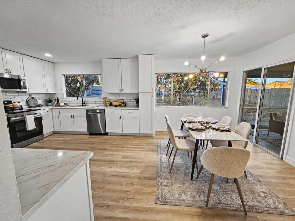 Photo of 433 SE Seahouse Drive, Port Saint Lucie, FL 34983 (MLS # R11162284)