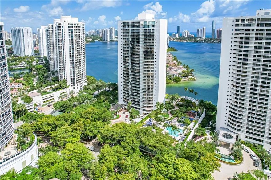 This spacious 2/2 PLUS office/den on Williams Island has been renovated from top to bottom! The bay & ocean views from the floor to ceiling windows will amaze you! Beautiful 30x30 Italian porcelain tiles throughout condo & on the wrap around balcony! Gorgeous kitchen features modern cabinetry w/ pull outs, silestone counters, stainless steel GE Profile appliances (w double oven), double sink, + wine fridge. New AC 2019 w/ Nest thermostat. Wet bar! Motorized blinds in main living area & bedrooms! Tons of closet space w/ built in cabinetry. Both bathrooms beautifully upgraded! Full service building w/ security, valet, fitness & club room, pool, & concierge. + Williams Island club, spa, tennis, dog park, marina, pool, courtesy bus & restaurants! Not just a condo, a lifestyle!