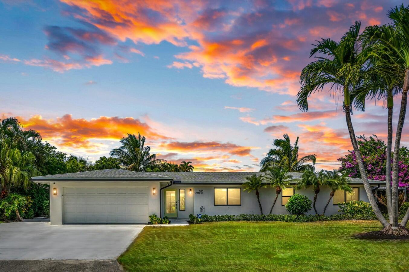 Welcome to your turnkey canal-front oasis, located just two houses from the main lake in the sought-after boating community of Lake Clarke Shores. This beautifully renovated 3-bedroom, 2-bathroom pool home perfectly combines modern luxury with the vibrant South Florida lifestyle.Inside, you'll discover a stunning custom kitchen featuring Calacatta stone countertops, a waterfall-edge island, a dedicated coffee bar, and elegant White Caffe appliances complemented by champagne brass hardware. Impact glass throughout the home not only enhances security but also fills the space with abundant natural light.The spa-like primary bath offers a serene escape with a freestanding soaking tub and a separate walk-in shower. Step outside to the limestone French-pattern pool deck, which inc