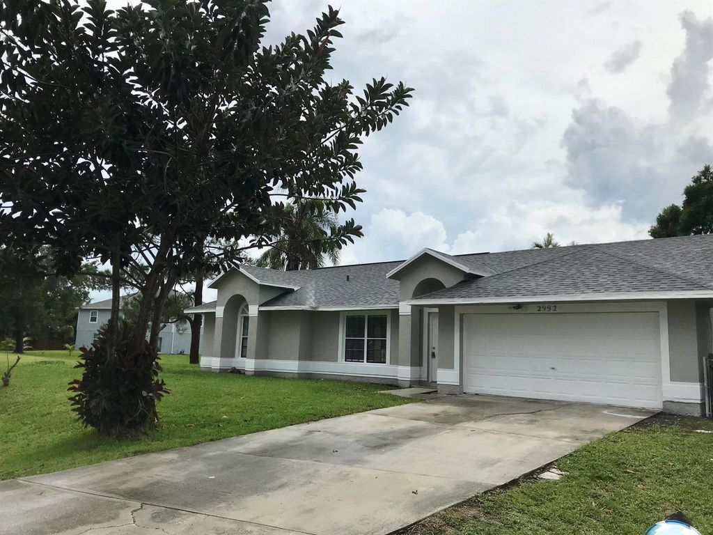 Photo of 2992 SW Lucerne Street, Port Saint Lucie, FL 34953 (MLS # R11011995)