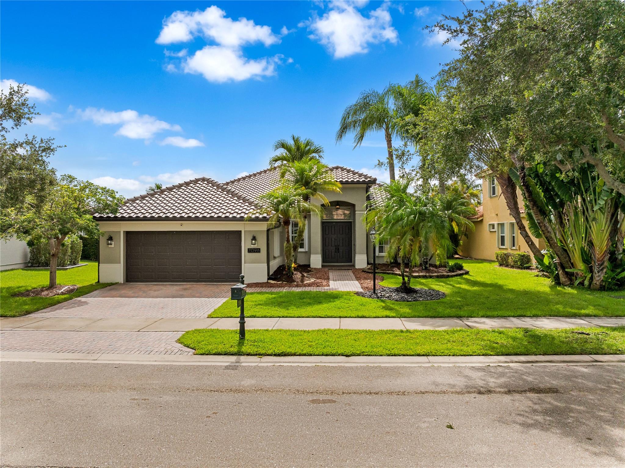 Pristine move-in-ready home in one of Parkland's most loved communities. Remodeled recently with luxe kitchen, spa baths, brand new roof, new quiet-close garage doors, new turf yard space and spanning water views from the expansive patio and pool area. The airy, open layout and water views from all sliders and windows in the kitchen, living area and primary bedroom make this home uniquely inviting and appealing. Low HOA Dues Includes Comcast High-Speed Internet, Cable, ADT Alarm, w/Many Amenities Including Heated Swimming Pool & Spa, Fitness Center, Party Room, Tennis/Pickle & Basketball Courts, Playground, On-Site Management, 24-Hour Guard Gate, Bike Ride To All A+ Schools, Close To Sawgrass Expressway, Parks, & Major Shops and Dining
