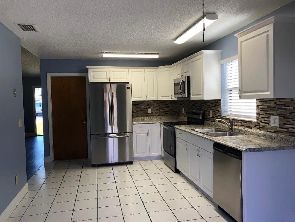 Photo of 5890 SE Wilsie Drive, Stuart, FL 34997 (MLS # R10686655)