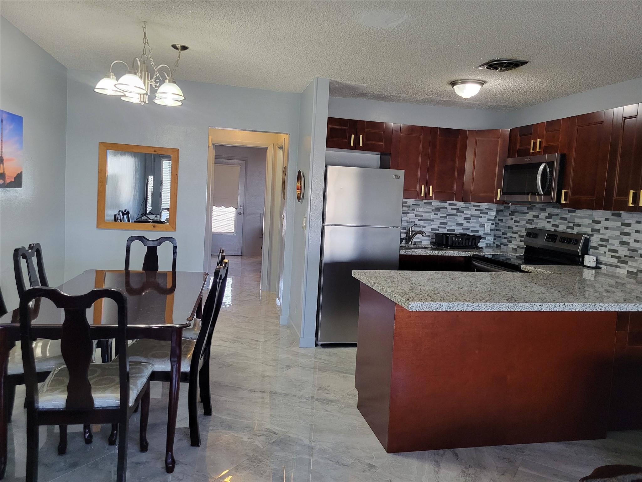 Remodeled 1 bedroom & 1 bath on 2nd floor. Floors are 18 inch ceramic tile. New open kitchen with counter seating with new cabinets, countertop, backsplash, and stainless appliances. All new bathroom with sliding shower doors, new toilet and vanity. New split a/c unit keeps unit icy cool. Nicely furnished. Association amenities include: heated swimming pool, active clubhouse, exercise room, library, billiards, walk/jog path and more. Low monthly association fees.