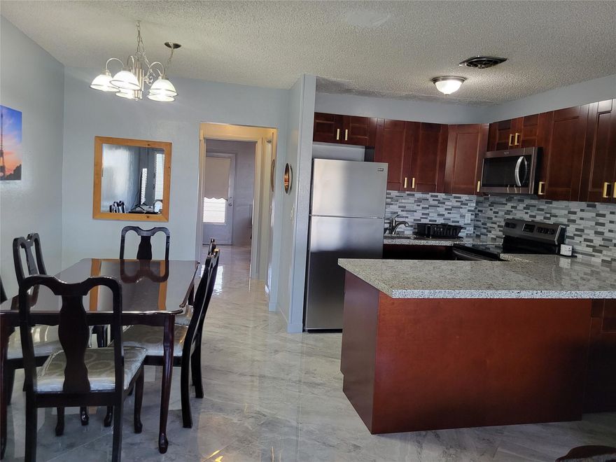 Remodeled 1 bedroom & 1 bath on 2nd floor. Floors are 18 inch ceramic tile. New open kitchen with counter seating with new cabinets, countertop, backsplash, and stainless appliances. All new bathroom with sliding shower doors, new toilet and vanity. New split a/c unit keeps unit icy cool. Nicely furnished. Association amenities include: heated swimming pool, active clubhouse, exercise room, library, billiards, walk/jog path and more. Low monthly association fees.