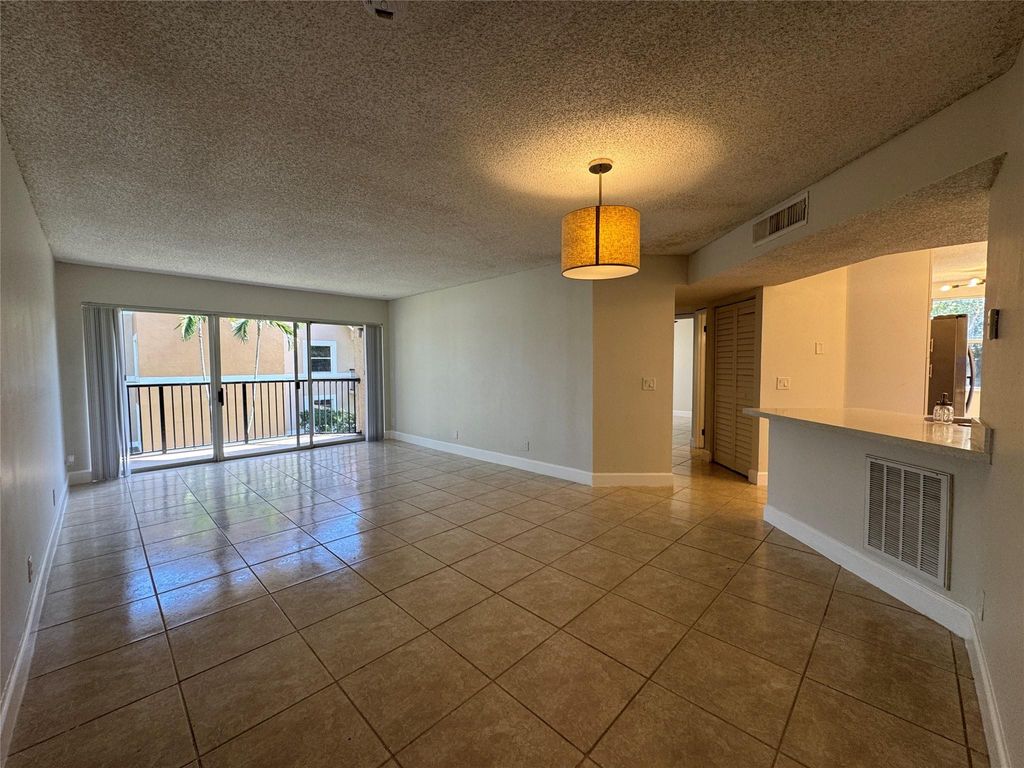 Photo of 9033 Wiles Road #208, Coral Springs, FL 33067 (MLS # F10520954)