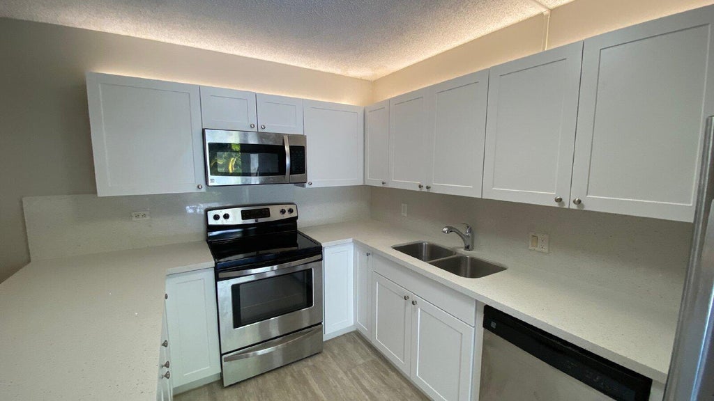 Photo of 1522 15TH Terrace, Palm Beach Gardens, FL 33418 (MLS # B26079760)