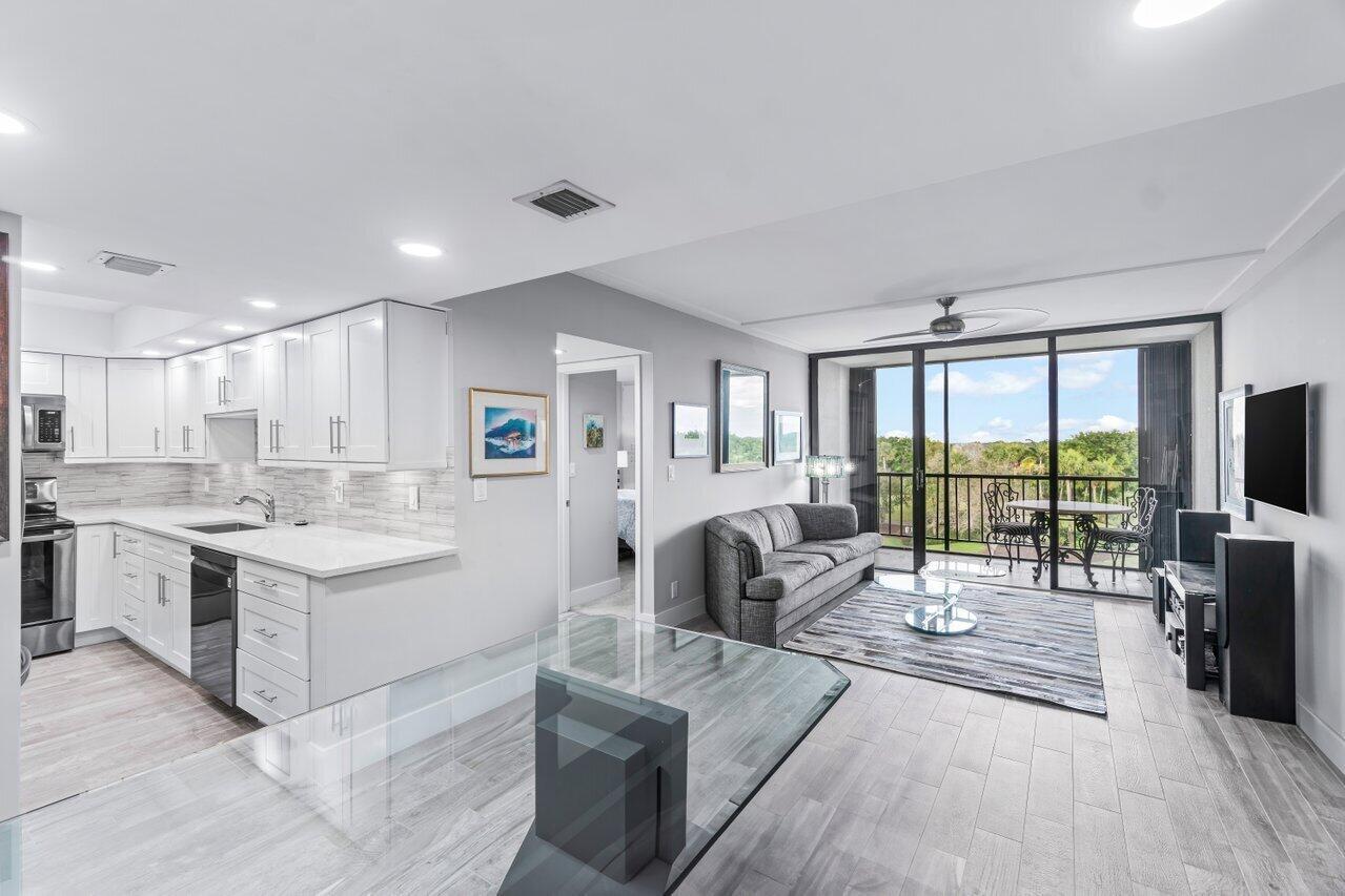 Welcome to your dream condo at 6797 Willow Wood Dr, Boca Raton, # 6066 is a fully renovated 2-bedroom, 2-bathroom residence offers 1,050 square feet of thoughtfully designed living space. Nestled in a vibrant community, this condo provides an unparalleled lifestyle with a range of luxurious amenities.Beautiful modern kitchen and bathrooms, w/d, porcelain tiles and ample storage space. The living area opens up to a private balcony, perfect for enjoying your morning coffee or unwinding in the evening while overlooking hole #3 on Fazio II Golf Course. Live your best life inside the Nation's #1 Private Residential Country Club Lifestyle offering resort-style living. PLAY our 4 Golf courses, 27 Tennis courts and 14 Pickleball courts; SHOP our retail store, golf and tennis pro s
