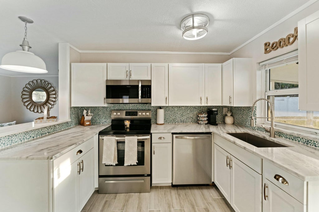 Photo of 3042 NE Savannah Road, Jensen Beach, FL 34957 (MLS # R11069194)