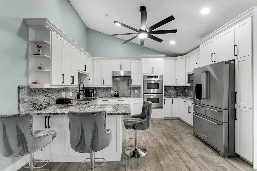 Photo of 5653 Golden Eagle Circle, Palm Beach Gardens, FL 33418 (MLS # B26037958)