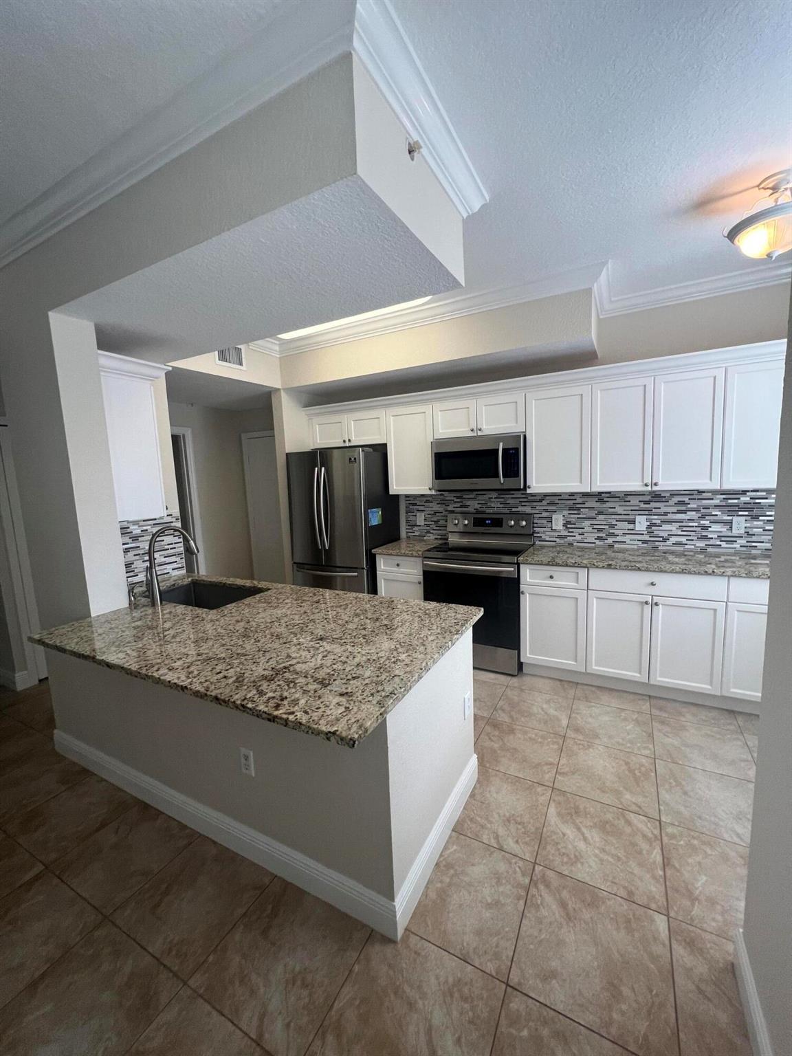 THIS UPGRADED 3 BR/2.5 BA TOWNHOME BOASTS A DESIRABLE FIRST FLOOR ENTRY AND A COVETED 1 CAR GARAGE. INTERIOR FEATURES INCLUDE CERAMIC TILE,ENGINEERED HARDWOODS, SS APPLIANCES AND FULL SIZE WASHER/DRYER. ALL 3 BEDROOMS ARE LOCATED UPSTAIRS. THIS HOME ALSO OFFERS A COVERED PATIO AND IS SITUATED WITHIN WALKING DISTANCE TO SHOPPING AND DINING. EASY ACCESS TO BEACHES,GOLF COURSES AND GARDENS MALL. CONVENIENTLY LOCATED NEAR I-95 AND TURNPIKE!