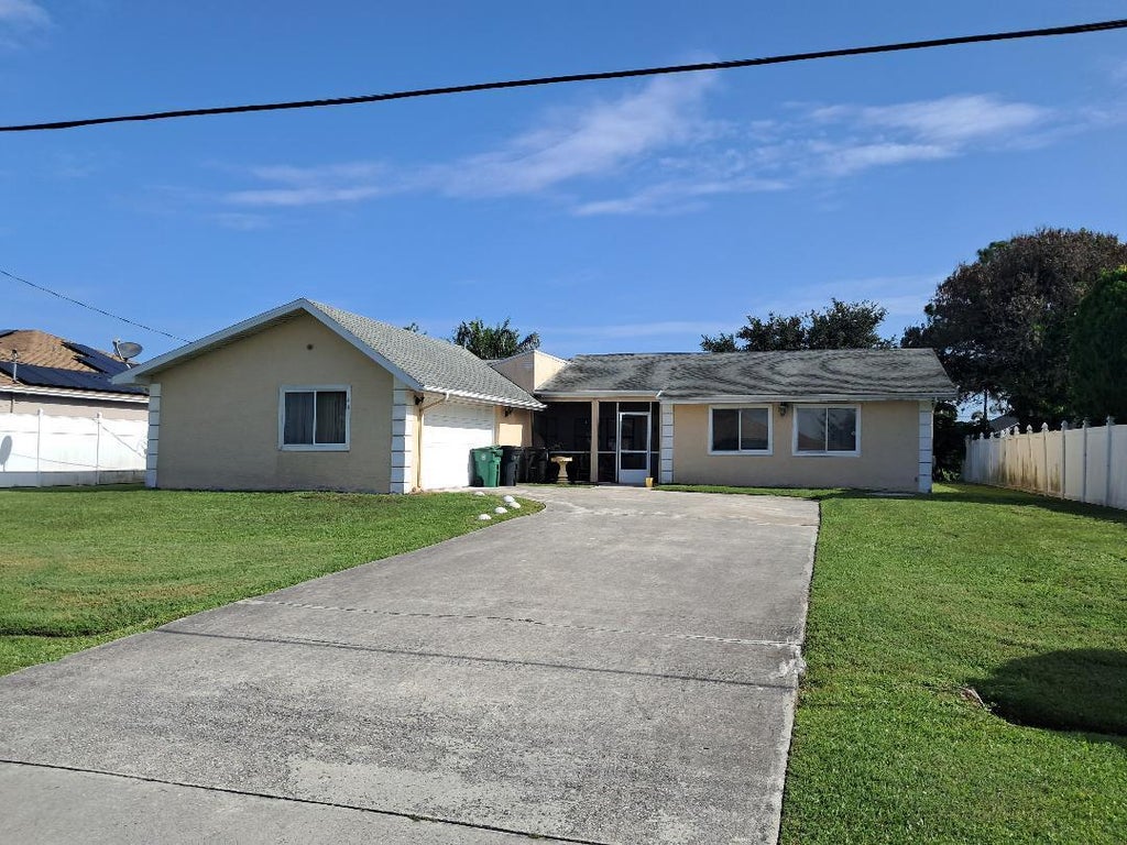 Photo of 441 SW Todd Avenue, Port Saint Lucie, FL 34983 (MLS # B26050805)