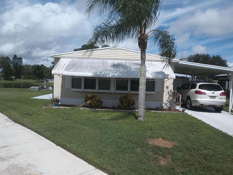 BEAUTIFUL LAKESIDE HOME in great condition located in the much desired 55+ community of Spanish Lakes Riverfront. This 2 bedroom mobile home has great views of the lake and sits on a cul-de-sac. The home comes completely furnished with newer AC unit 2020, new water heater, walk-in shower, new window treatments and new laminate flooring throughout. Meticulously maintained by the owner, the home includes a new shingled roof installed in 2017 and freshly painted drive, carport and patio areas. Lot rent covers clubhouse amenities include pool, tennis courts, shuffleboard and so much more. Also includes weekly garbage and recycling pick up and lawn maintenance and Property Taxes. Market rent (new owner): $983.06 a month for 12 months