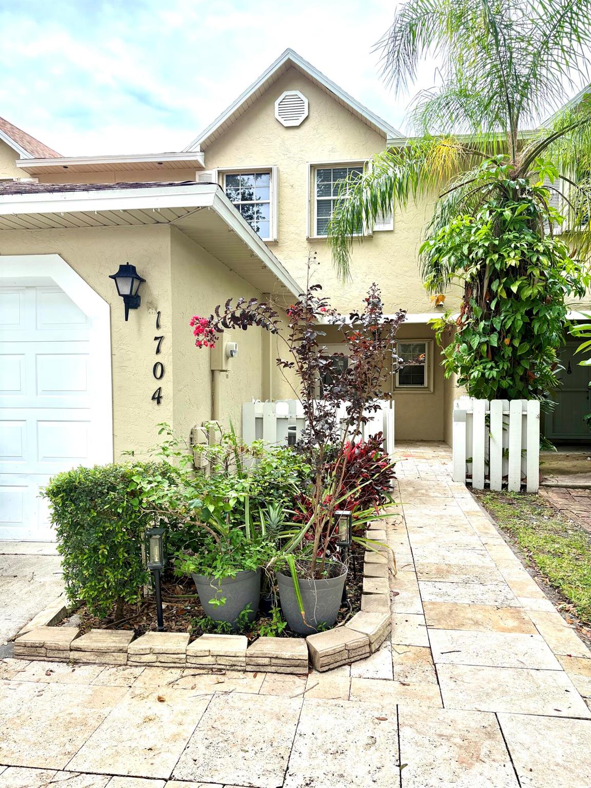 Don't miss this spacious, centrally located Townhome, near shopping, restaurants and Okeeheelee Park! This 3/2 and half bath with a shortened 1 car garage has an additional loft area as well as a separate office space, and beautiful tile floors that welcome you in. The patio leads to a grassy area with Tennis/ Basketball courts, a playground and jogging path that surrounds the lake! All this fun is merely steps from your backyard! Come see this move in ready home!