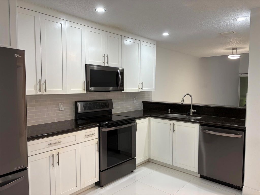 Photo of 1704 Maplewood Drive, Greenacres, FL 33415 (MLS # R11104510)