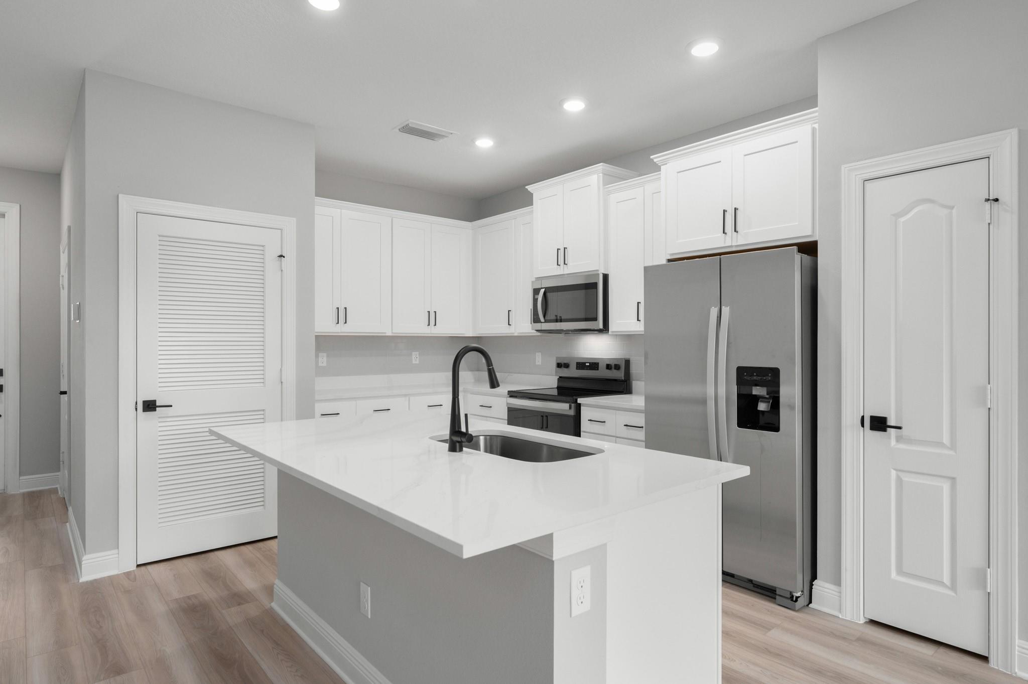 Ask us about our incentives, builder paid closing cost, and more! The beautiful Mateo plan is located within the gorgeous community of Celebration Pointe. This new one-story home features an open floor plan, 3 bedrooms and 2 full baths complete with an array of unbelievable upgrades including stainless-steel Whirlpool® appliances, sprawling granite countertops with an island, stunning 42” white-wood cabinets with crown molding and an attached garage. The Mateo encompasses a master suite complete with a walk-in closet, as well as a laundry room, a back patio, covered front entryway and front-yard landscaping. Celebration Pointe offers residents numerous amenities including a pool, walking paths and a future community clubhouse all in a premier location.