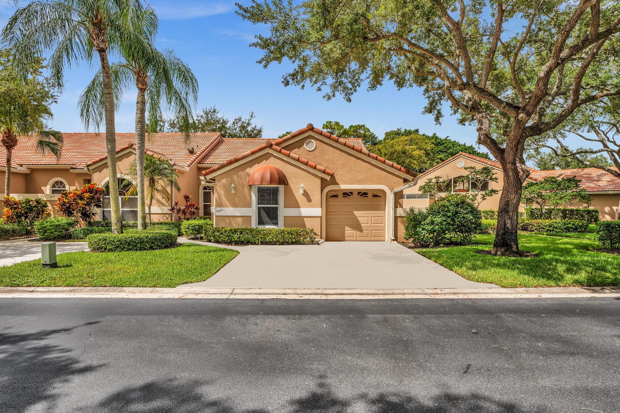 Beautifully appointed single-story end-unit villa featuring an open floor plan with soaring ceilings. Available for season or annual rental. This fully furnished, turnkey residence is designed for comfort and convenience. The villa offers 3 bedrooms, 2 bathrooms, a 1-car garage, and a thoughtfully designed split floor plan for privacy. Enjoy an oversized enclosed covered patio, adding approximately 300 sq. ft. of versatile living space. Located directly across from the newly renovated, heated community pool, this home makes relaxation effortless. Perfectly situated in Palm Beach Gardens, with quick access to the Turnpike, I-95, premier shopping, dining, and entertainment. PGA National offers world-class amenities, including championship golf, a luxury spa, and full tennis facilities.