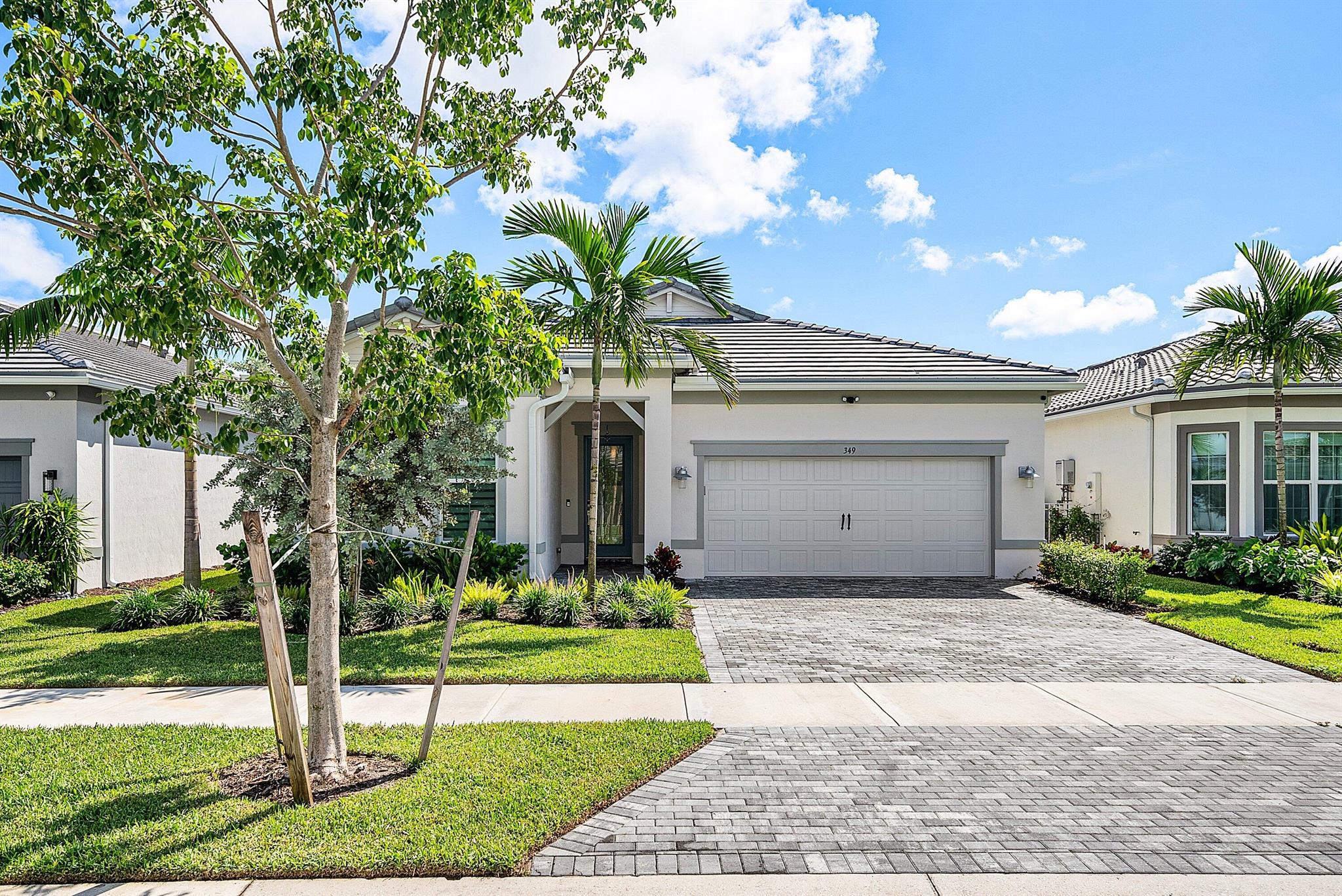 Here's your opportunity to rent this imaculate 2024 home featuring 3 bedrooms and 2.1 baths. This property showcases over $100,000 in upgrades, including wood-like tiles throughout, enhanced tile work in the bathrooms and kitchen, fresh paint, and a covered patio. The impressive gourmet kitchen is equipped with a spacious island offering extra storage and seating, a large pantry, and a gas range. The expansive primary suite features two walk-in closets, dual sinks, an oversized shower, and a convenient passthrough to the laundry room. The second bedroom is thoughtfully separated for privacy, includes a walk-in closet, and features an ensuite bath. The third bedroom, currently utilized as a den, boasts double doors, a walk-in closet, and flexibility for your lifestyle needs.