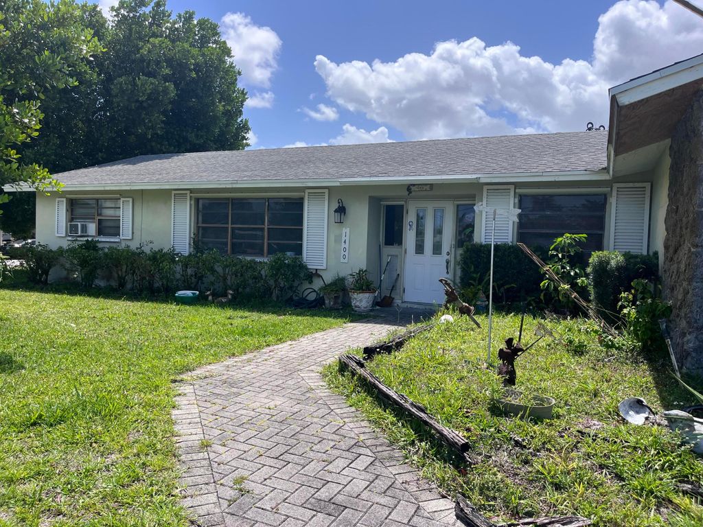 Photo of 1400 Flagler Boulevard, Lake Park, FL 33403 (MLS # B26017818)