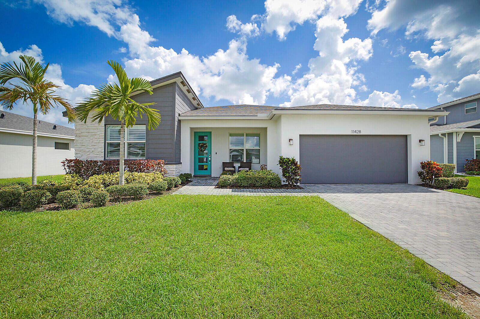 Motivated sellers! Mattamy quality-built home offers 3 bedrooms, 2.5 baths, and 2,100 sq. ft. of modern living. The open-concept design showcases soaring ceilings, natural light, and a stylish kitchen with quartz countertops, stainless steel appliances, gas range, & large island. The spacious primary suite is a true retreat with an expansive custom closet, large walk-in shower, and dual vanities. A versatile flex space and 2-car garage with OX flooring and Craftsman storage system add to the home's appeal. Enjoy the covered patio, lakefront view, and fenced yard. Community amenities include a resort-style pool, clubhouse, fitness center, and pet-friendly paw park. HOA covers lawncare, irrigation, internet, cable. Minutes from Tradition Square, Cleveland Clinic, & I-95 for easy commutes.