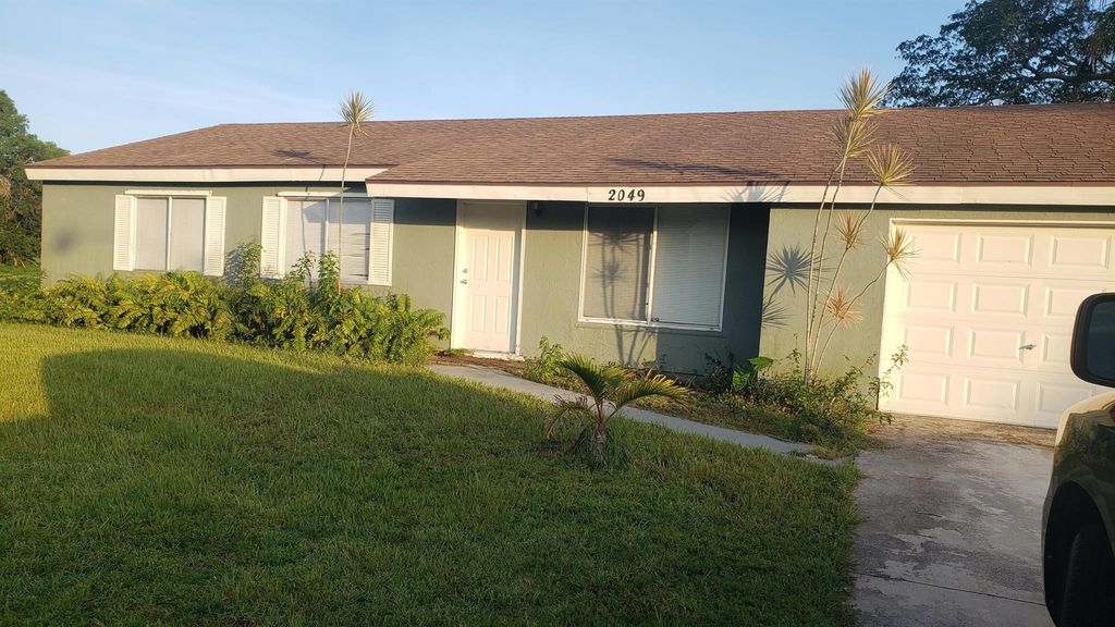 Photo of 2049 SE Parkwood Circle, Port St Lucie, FL 34952 (MLS # R10899304)
