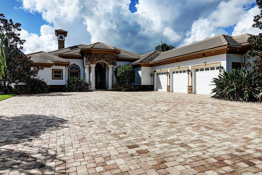 Luxury living on the St Lucie River in this one-story custom 2016 gated estate on 1 acre at end of private cul-de-sac. With 4 bedrooms,4 baths,& nearly 5,000 a/c sq ft,this home blends elegance, privacy,& functionality. CBS construction, all impact glass,3 zoned A/C's,3 Tankless Water Heaters,3-car A/C garage,& whole-house generator ensure peace of mind. Coffered ceilings, crown moldings, wet bar, open layout,& designer finishes showcase craftsmanship. The luxurious Primary bathroom feels like a spa w/deep soaking tub, dual vanities, walk-in glass shower,& designer finishes,& the 2 walk-in closets have custom built-ins.The gourmet kitchen features Subzero, Wolf,& Bosch appliances, granite countertops & island opening up to expansive living areas and riverfront views.