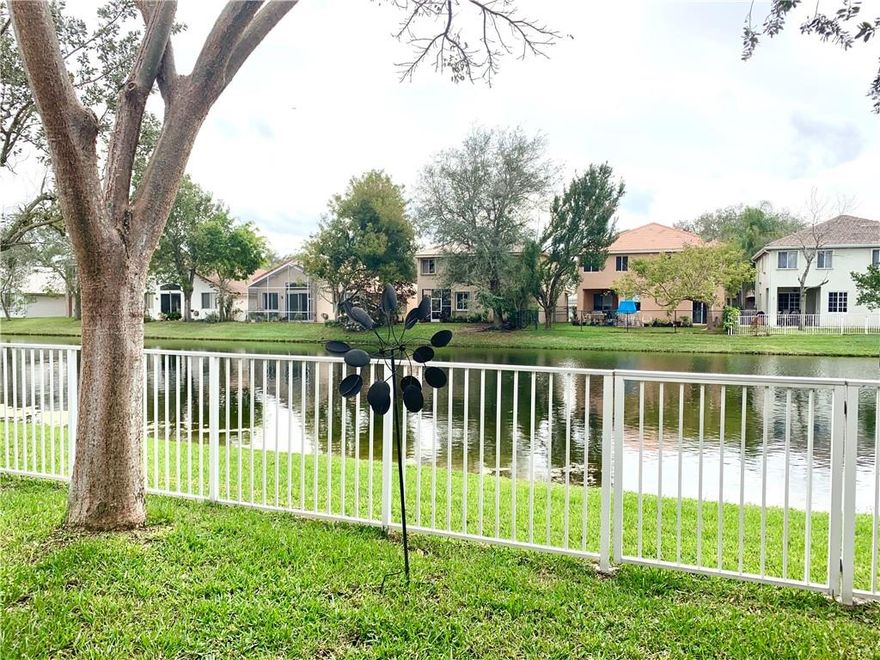 Beautiful single family home on a waterfront lot, with a fenced yard within the highly sought after guard gated community of Regency Lakes. This home offers an open-concept floor-plan, high vaulted ceilings, upgraded custom kitchen with stainless steel appliances, granite countertops, extra large deep sink and breakfast area.  Upgraded Bathrooms, Master Bath has double sinks, walk-in shower and spa/jacuzzi bathtub.  Enjoy the tranquil water views from your covered patio.  HOA fees includes lawn care, security, high speed fiber optic internet, ADT alarm & recreation facilities.  Clubhouse, heated pool, spa, tennis/pickle ball, volleyball and basketball courts.  Conveniently located close to Sawgrass Expressway, parks, dining, shopping and schools.