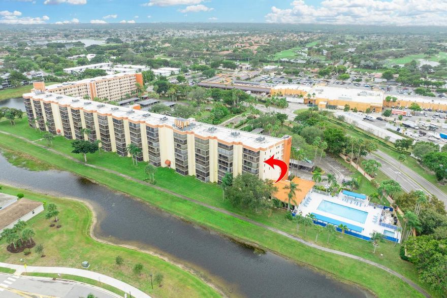 End-unit, freshly painted, 55+ community, 3-bedroom, 2-bath condo with lake and pool views. Updated and spacious layout with split bedrooms and an updated eat-in kitchen. Enclosed oversized balcony adds extra living space and features three exposures, plus a fourth exposure at the front of the unit. Sunrise and sunset views. Conveniently located within a short distance to shopping, public library, houses of worship and senior center. Building amenities include a club room, with full access to Huntington Towers Inc. clubhouse amenities: indoor and outdoor pools, fitness centers, and classes. Ample storage with multiple closets in the unit and an additional locked hallway storage room.  Fire sprinklers in building could offer insurance discounts.